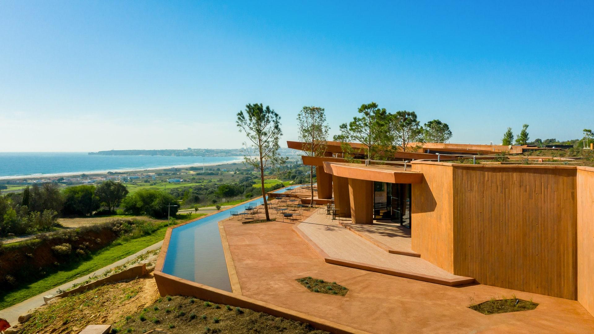 Palmares clubhouse terrace and reflecting pool above Lagos Bay
